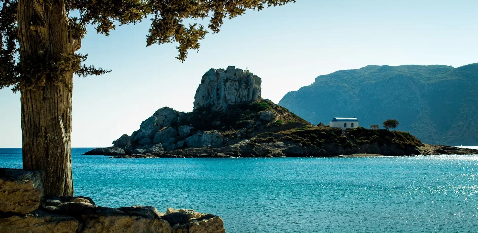 Kastri islet and its white chapel in Kamari bay at Kefalos, twenty-five minutes west of Kos airport