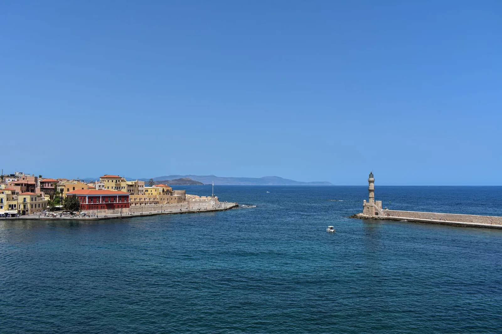 The entrance to the old Venetian harbour of Chania in Crete, with the Egyptian lighthouse on the breakwater