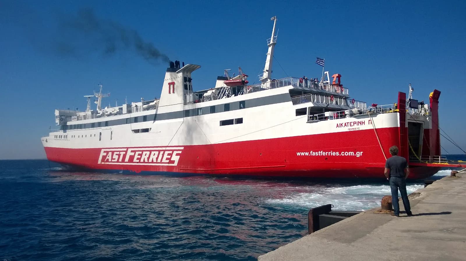 The Fast Ferries ship Ekaterini P docking stern-first at the quay of the New Port at Tourlos, Mykonos