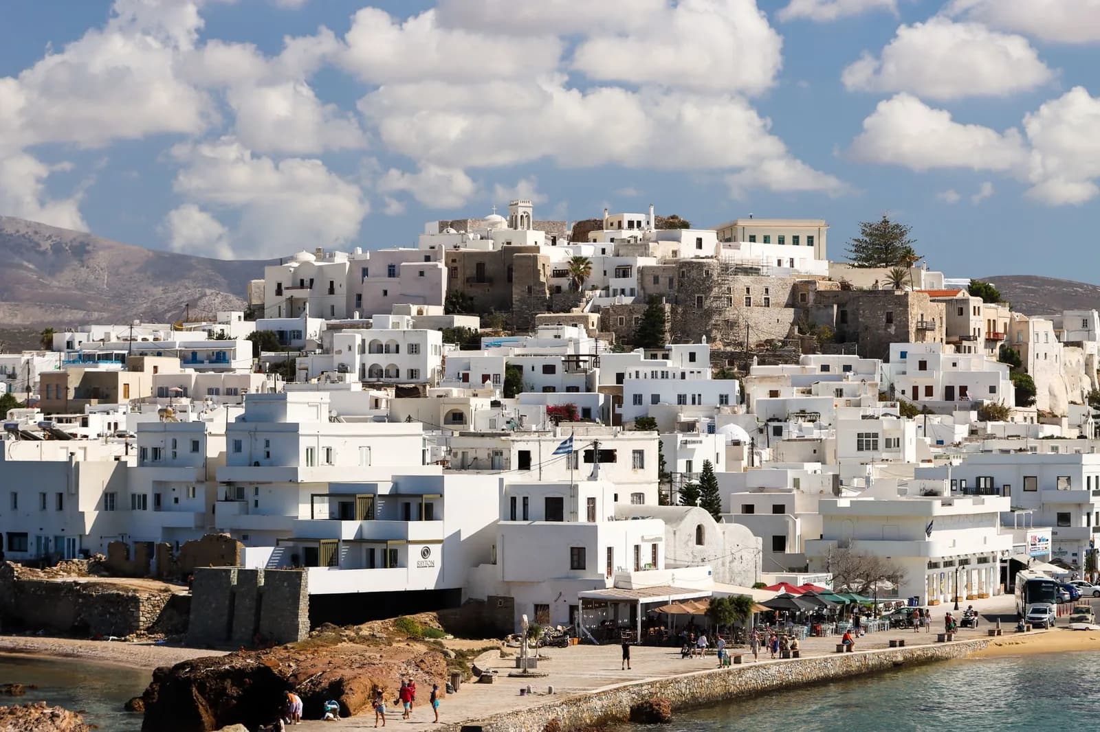 Naxos Chora seen from the water, the harbour front below and the Venetian Kastro above it