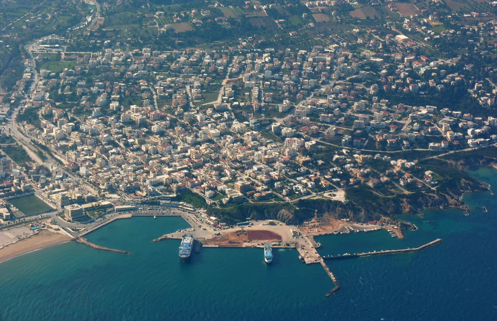 Aerial view of Rafina port in Attica with two ferries moored at the quays beside the town