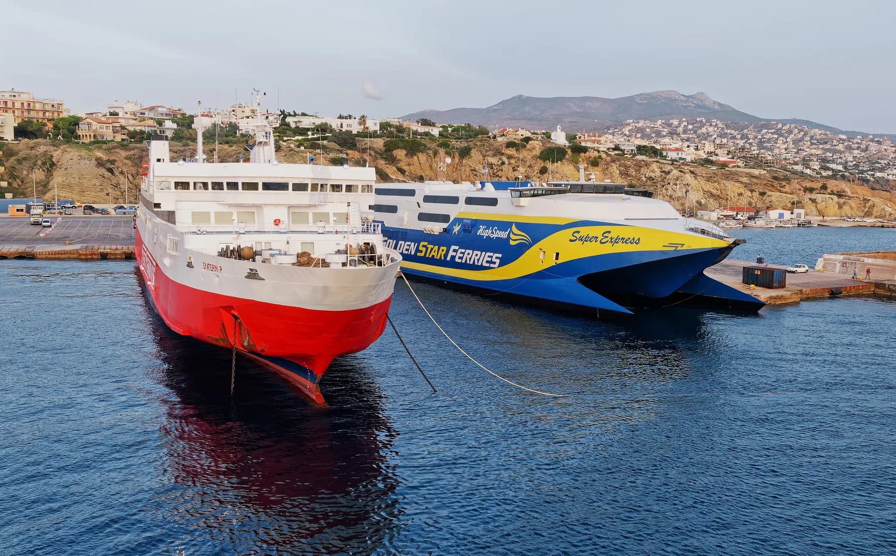 A ferry and the Golden Star Ferries high-speed catamaran Super Express moored at the quay in Rafina port, Attica, Greece