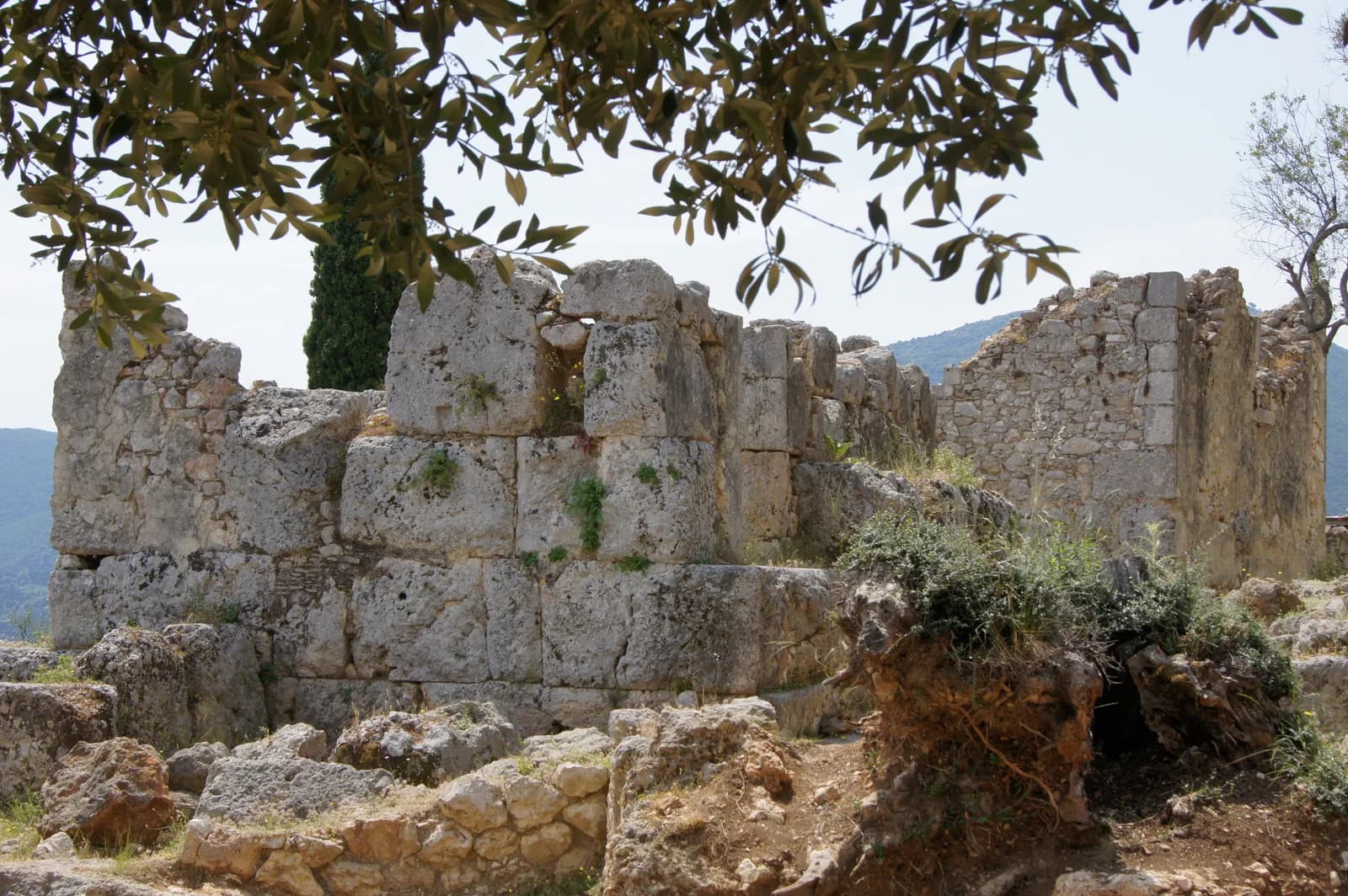 Stone walls of the excavated site at Agios Athanasios above Stavros on Ithaca, Greece, known as the School of Homer and presented as the palace of Odysseus
