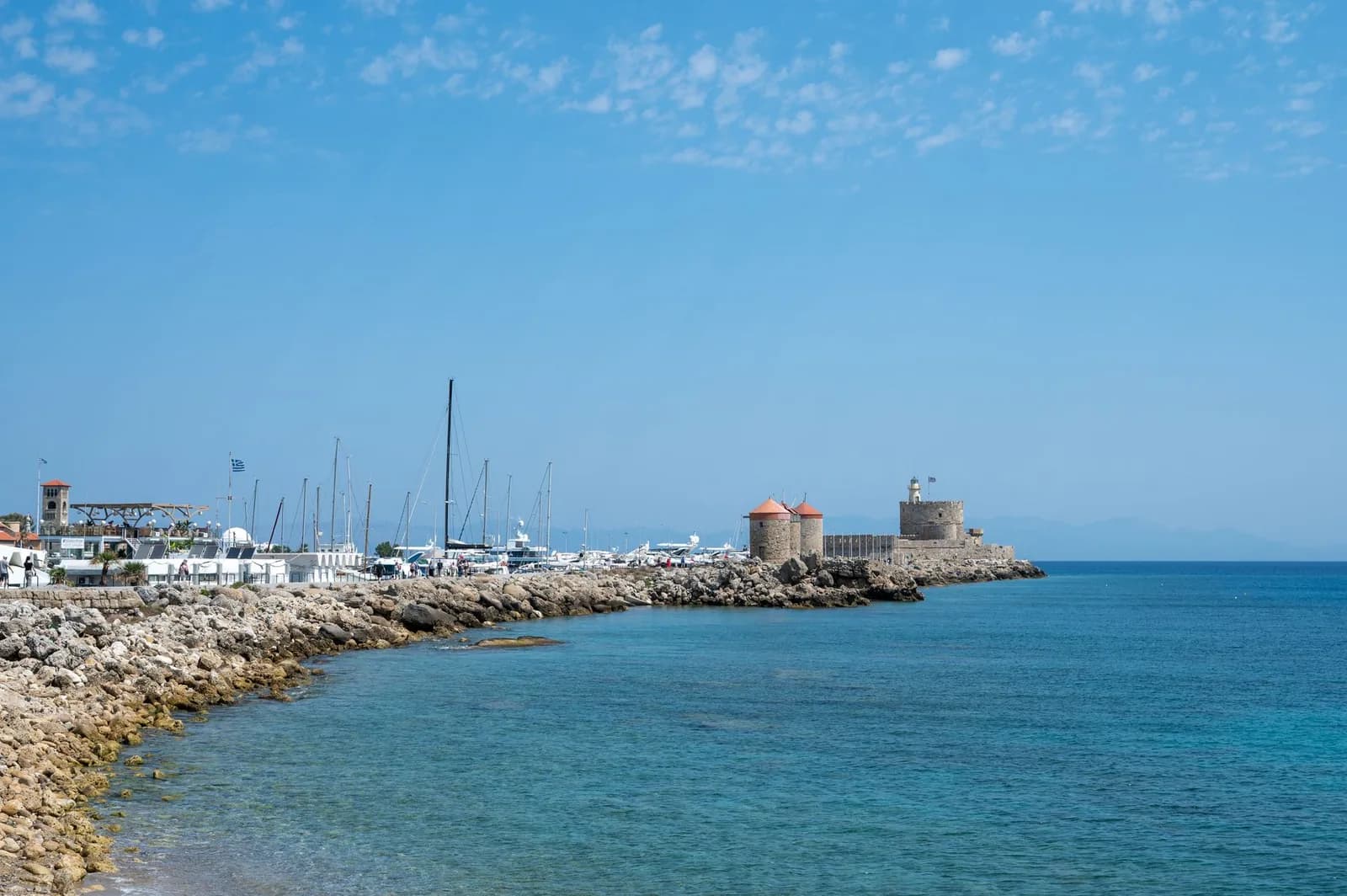 The Greek coast at Mandraki, Rhodes, with the fortress of Saint Nicholas on the mole